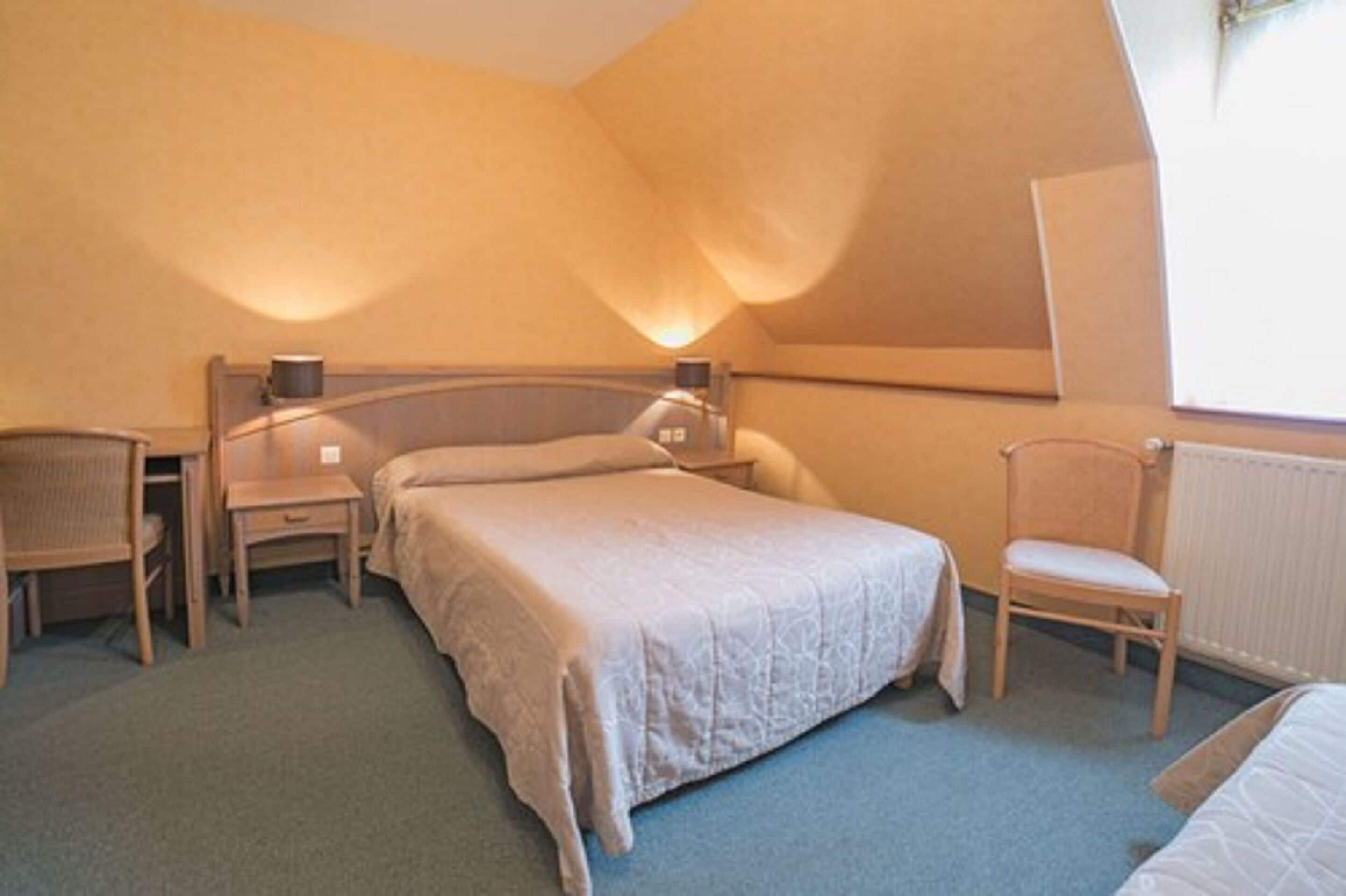 comfort quadruple room | premium bedding, desk, laptop workspace, soundproofing