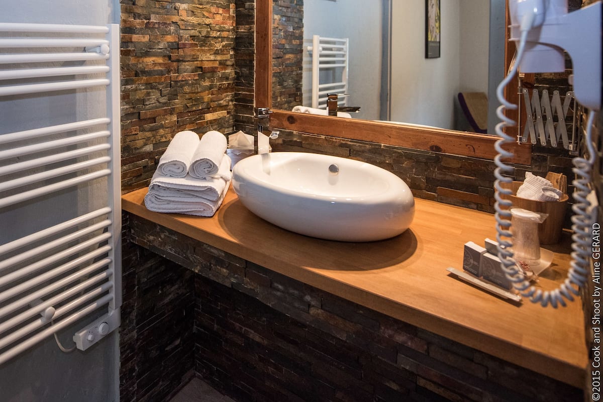 superior double room | bathroom | shower, free toiletries, hair dryer, towels