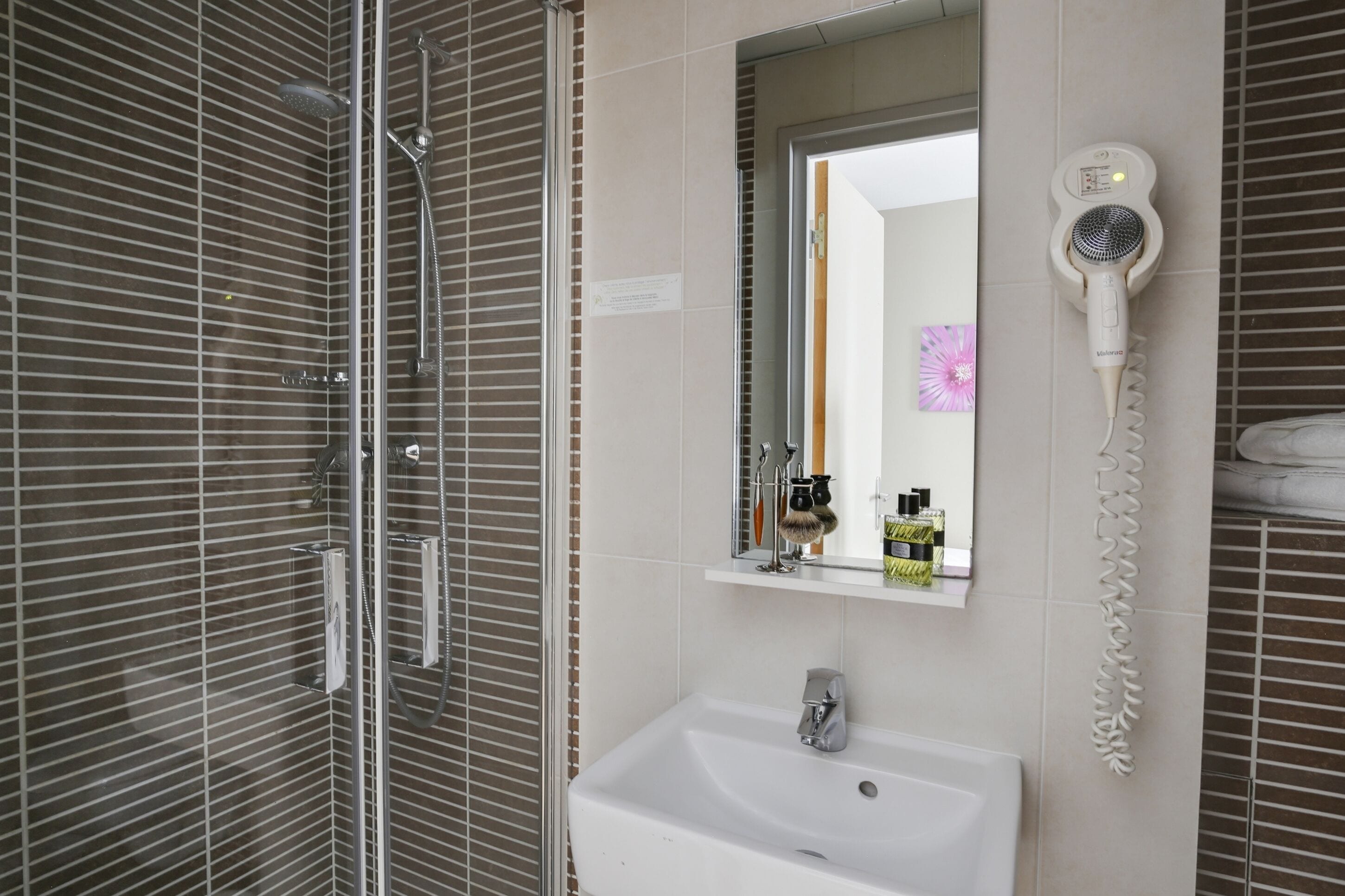 shower, eco-friendly toiletries, hair dryer, towels