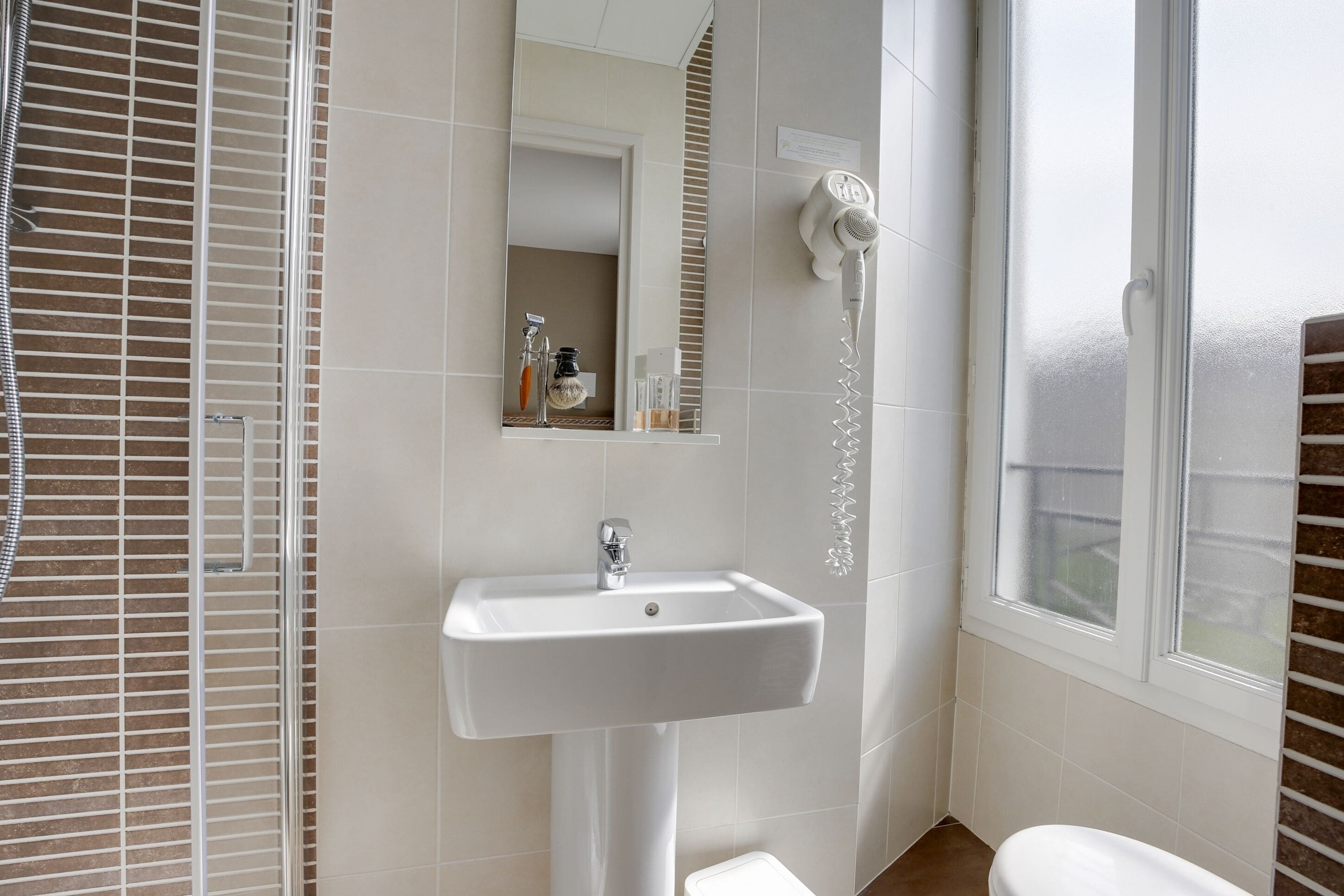 double or twin room | bathroom | shower, eco-friendly toiletries, hair dryer, towels