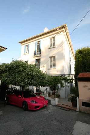 A two-story building with a balcony on the second floor.