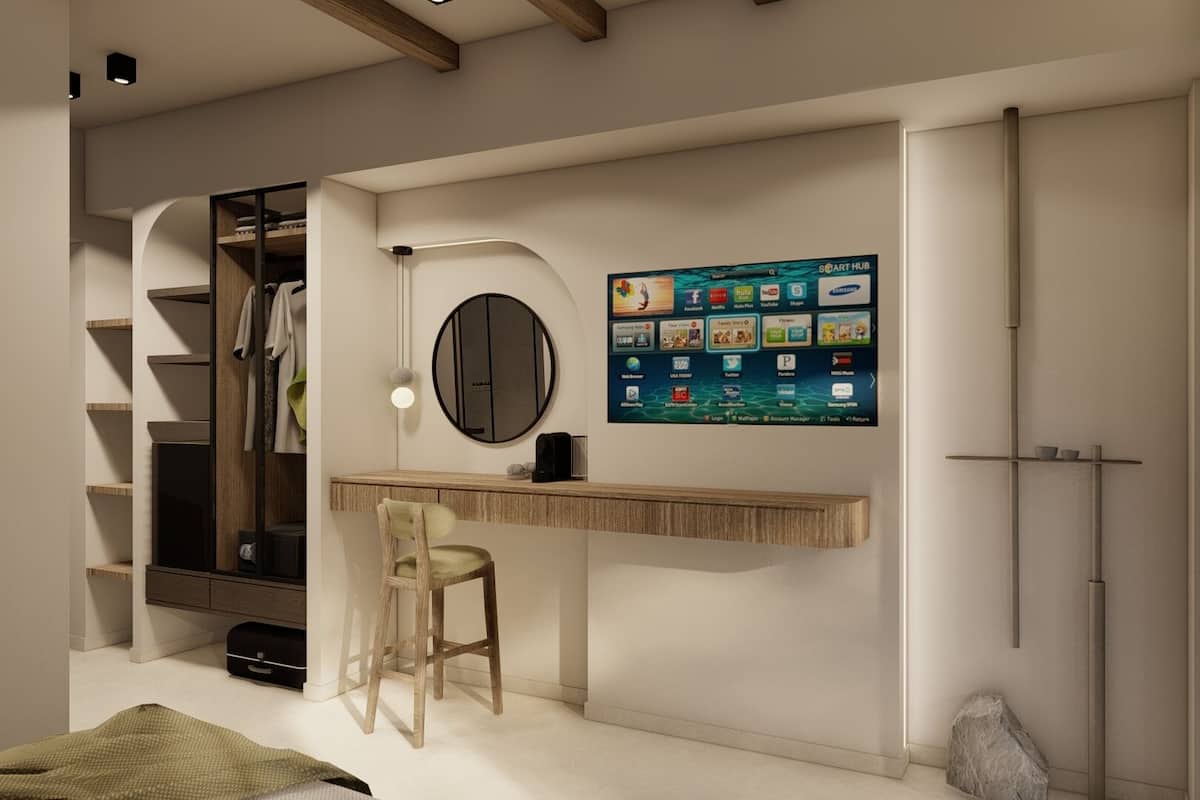 A modern room with a desk, chair, and a wall-mounted digital display.