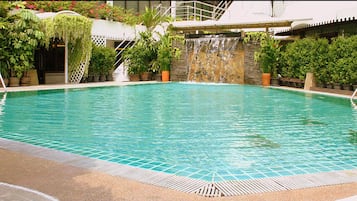 Outdoor pool, open 7:00 AM to 7:00 PM, pool umbrellas