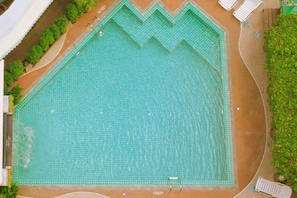 Outdoor pool, open 7:00 AM to 7:00 PM, pool umbrellas
