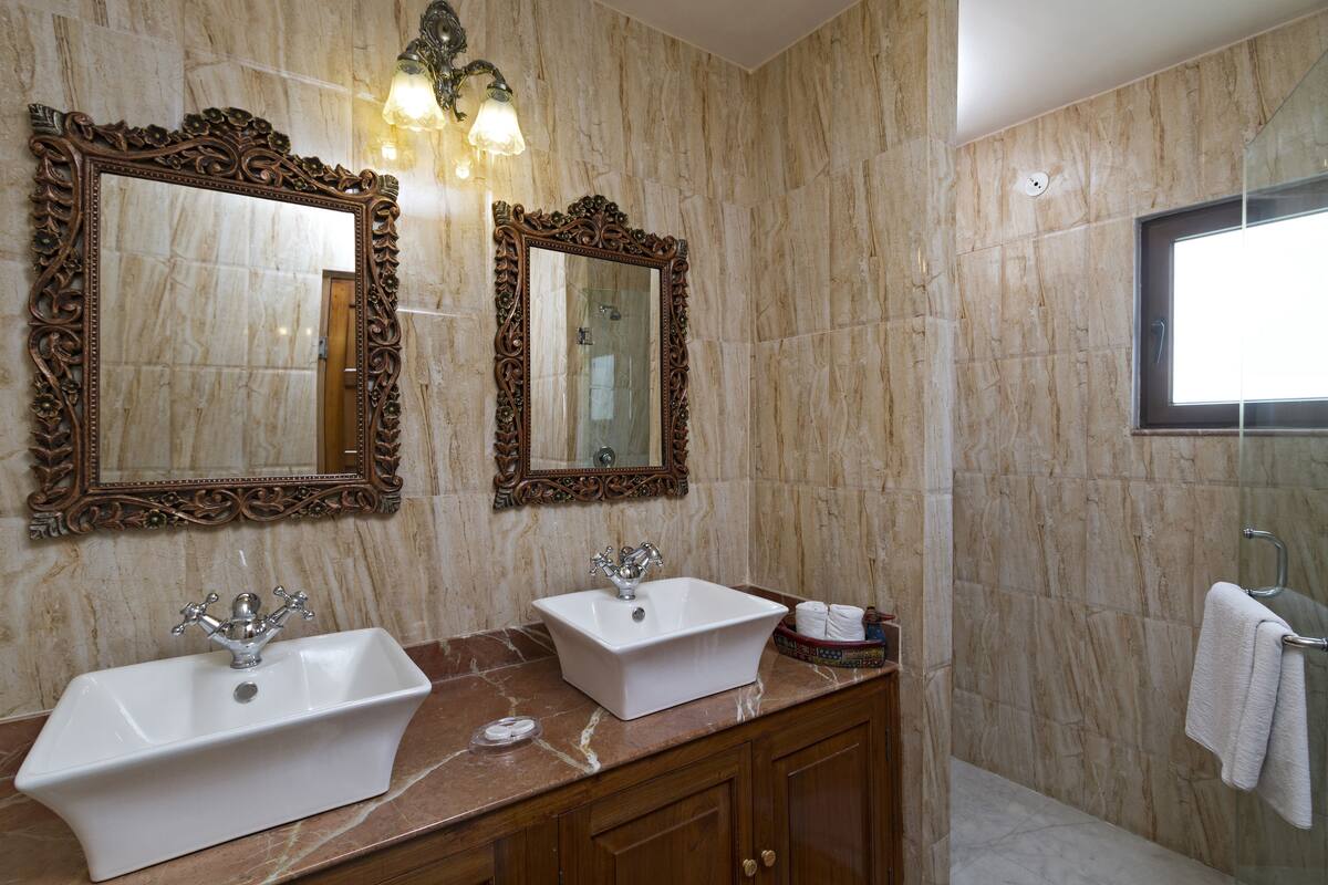 super deluxe room with complimentary airport pick up | bathroom sink