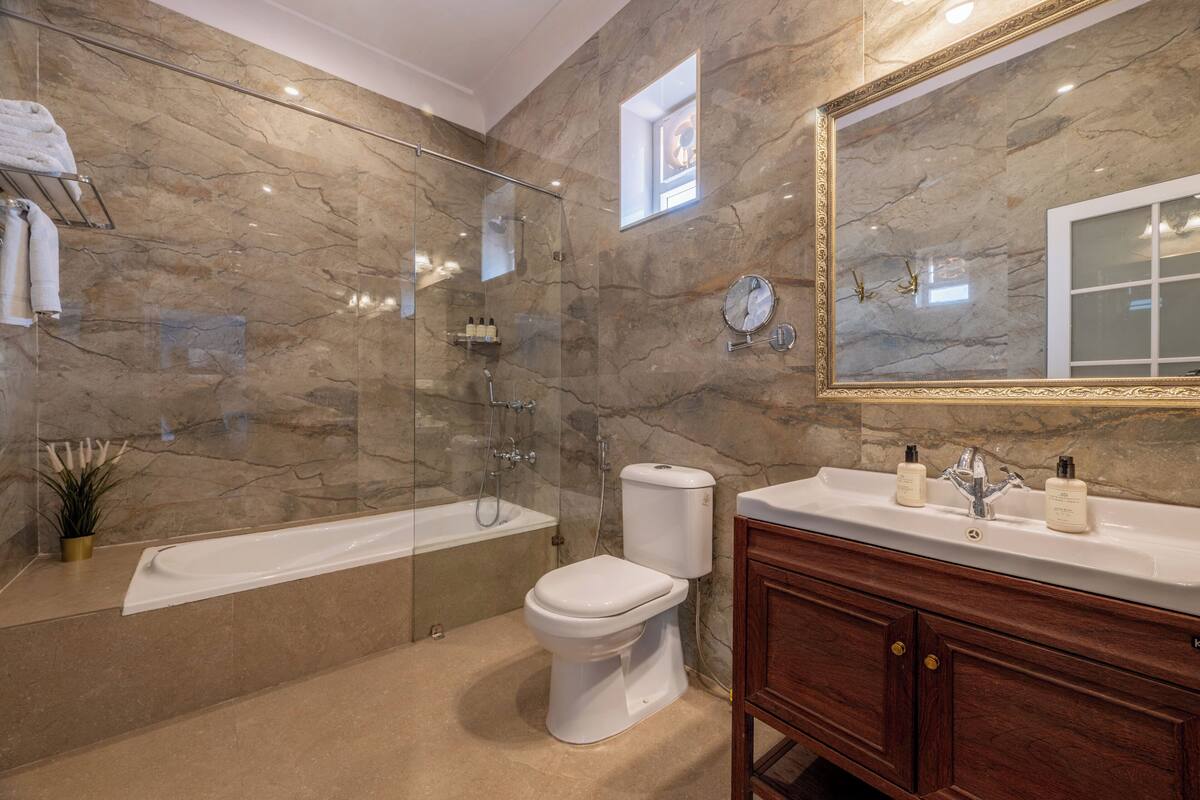 superior room with full day use of car with chauffer and complimentary airport pick up | bathroom | designer toiletries, hair dryer, slippers, bidet