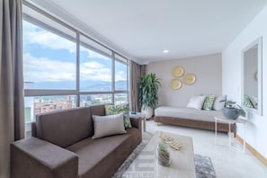 Superior Apartment | Living area | 43-inch Smart TV with satellite channels, TV