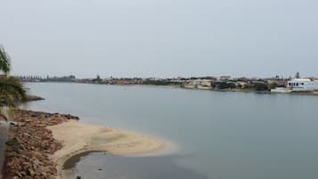 Enjoy a serene riverside escape with access to a sandy beach.