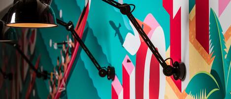 A wall with a colorful abstract mural.