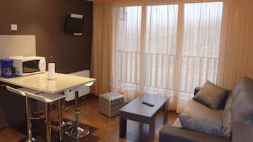 Superior Studio 4 guests | Living room | 36-inch flat-screen TV with digital channels, TV