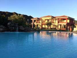 Outdoor pool, pool umbrellas, sun loungers