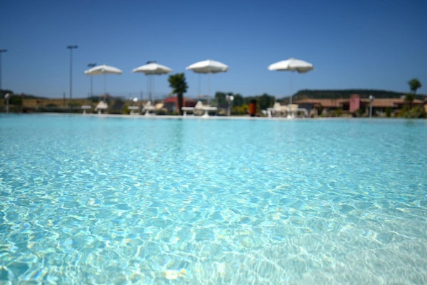 Outdoor pool, pool umbrellas, sun loungers