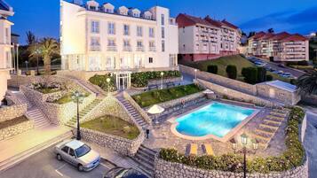 Outdoor pool, pool umbrellas, pool loungers
