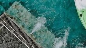 A person lying on a white float in a pool with clear blue water. - A2 Pool Resort (Ratsada)