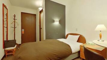 Premium bedding, desk, laptop workspace, blackout drapes