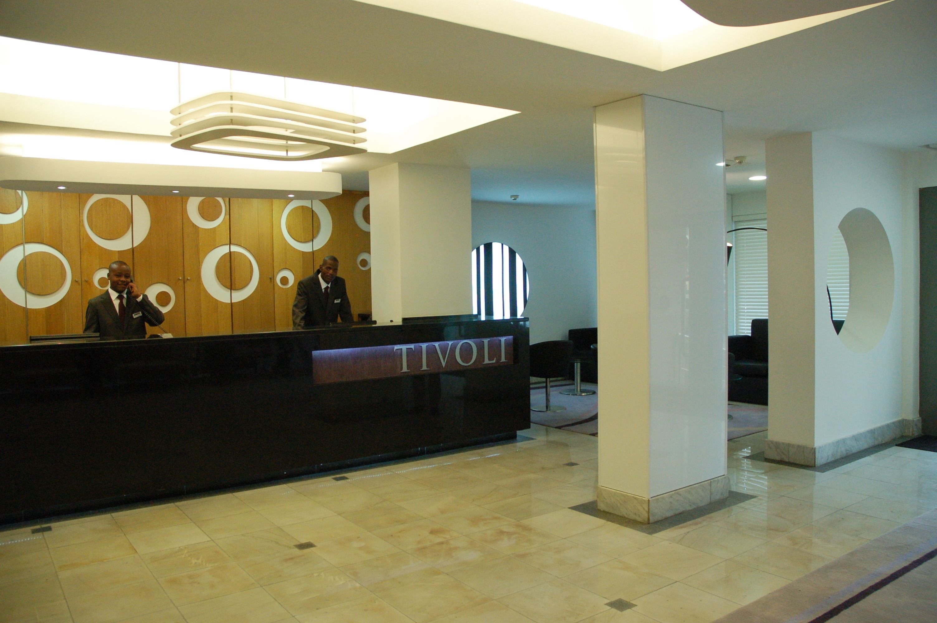 A reception desk with a sign reading "TIVOLI".