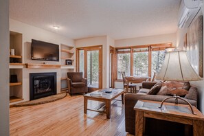 65-inch flat-screen TV with cable channels, TV, fireplace