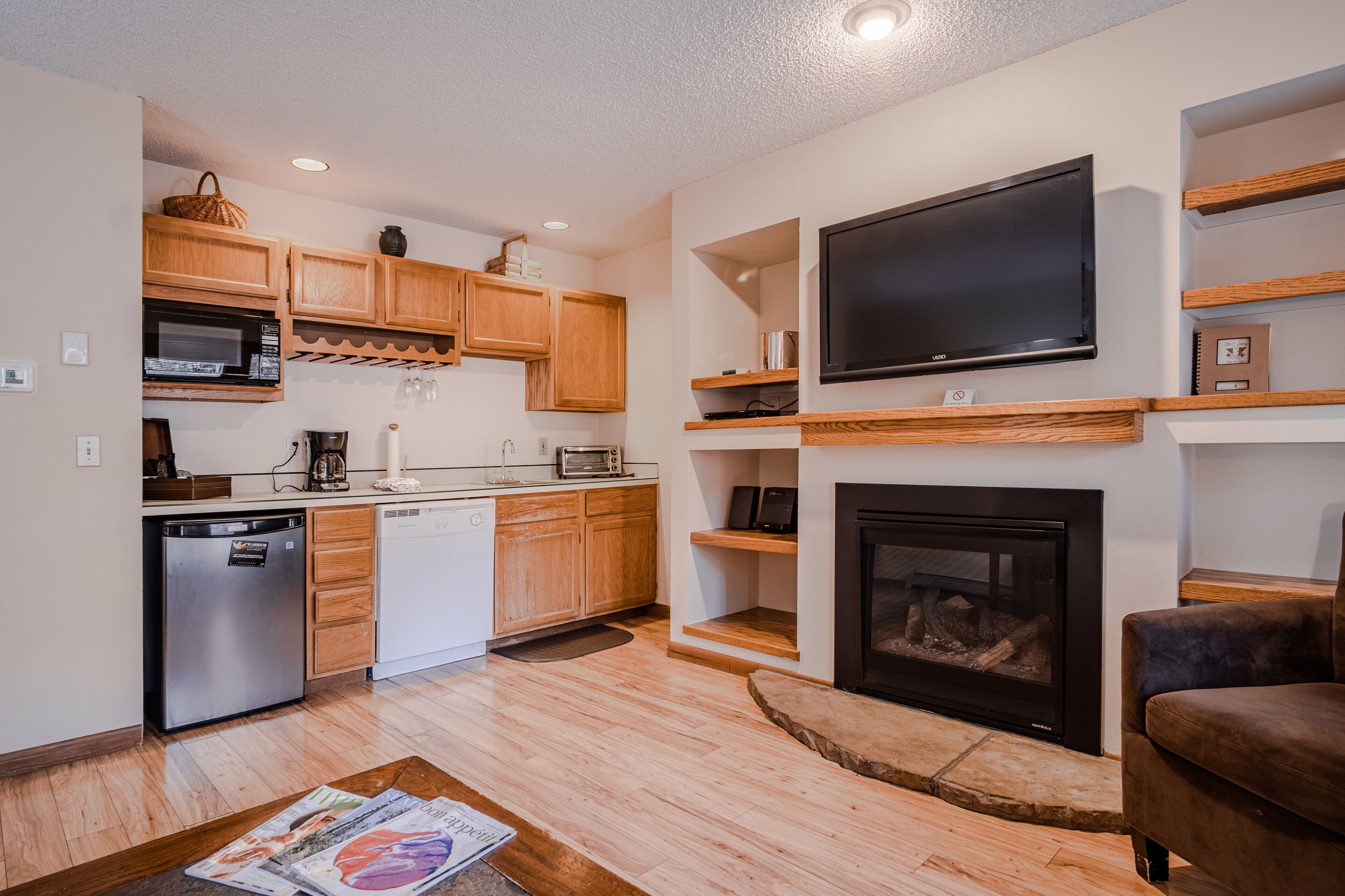 suite | living area | 65-inch flat-screen tv with cable channels, tv, fireplace