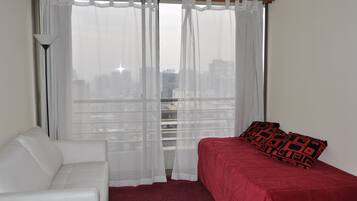 Standard Apartment Triple | Living room | 32-inch LCD TV with cable channels, TV