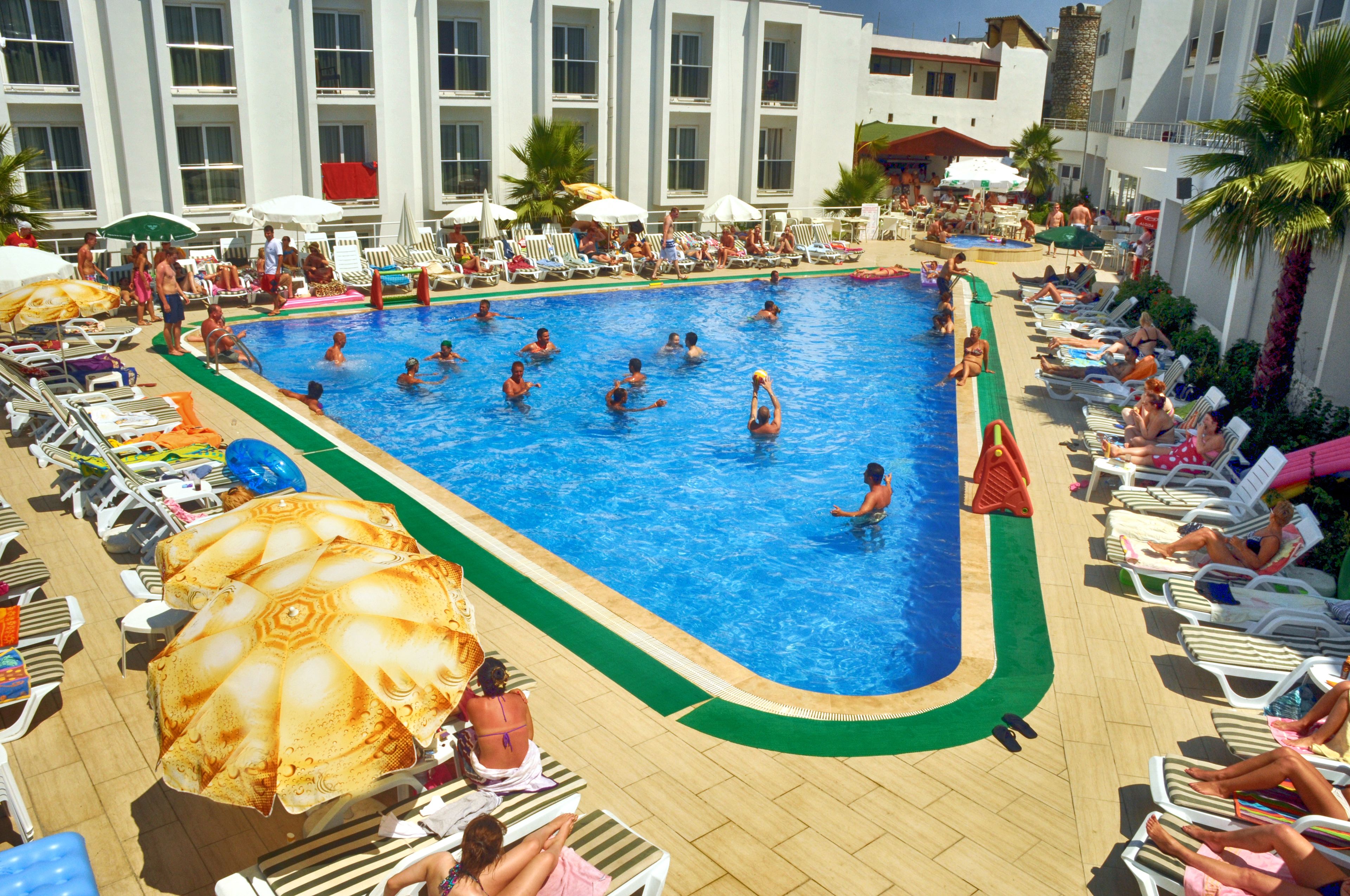 seasonal outdoor pool, pool umbrellas, pool loungers