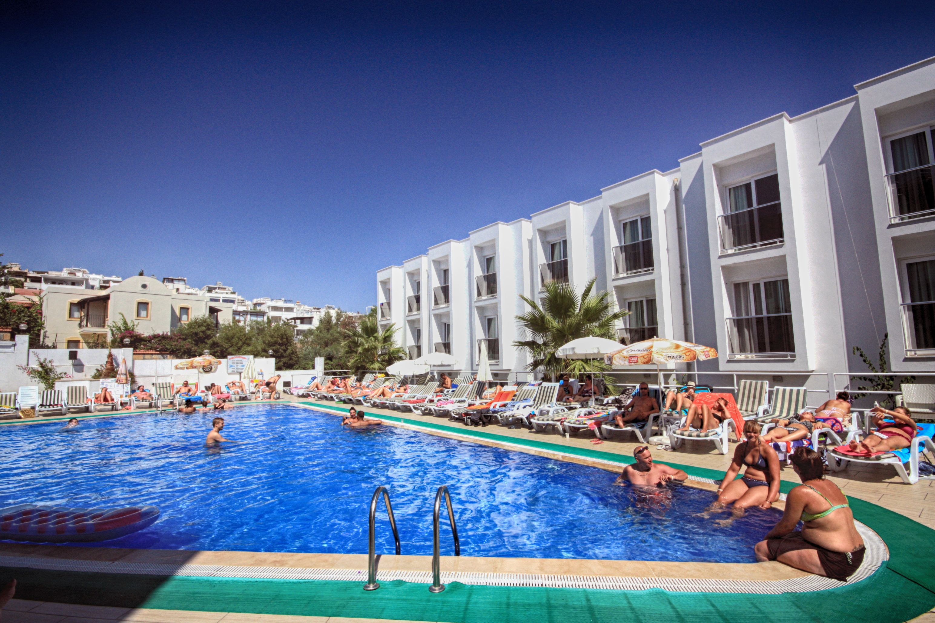 seasonal outdoor pool, pool umbrellas, pool loungers