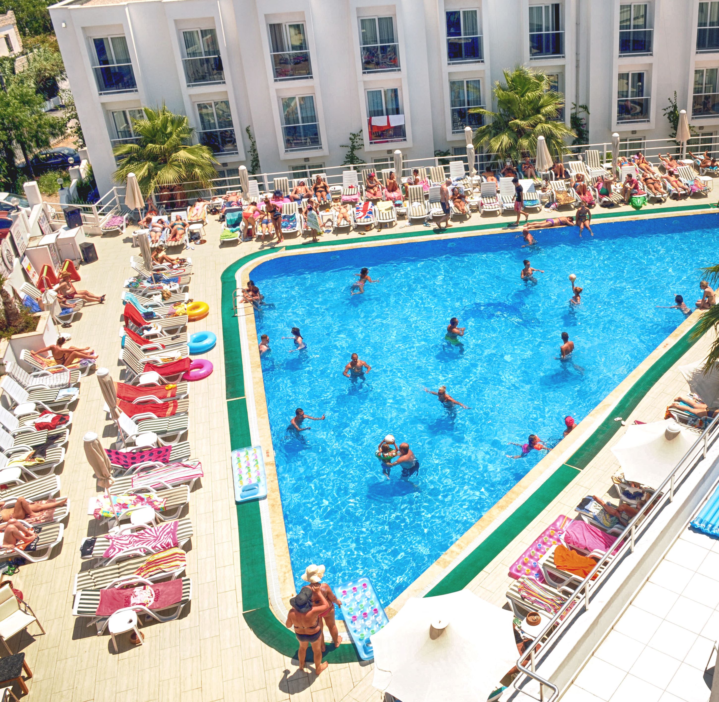 seasonal outdoor pool, pool umbrellas, pool loungers