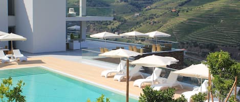 Seasonal outdoor pool, pool umbrellas, sun loungers