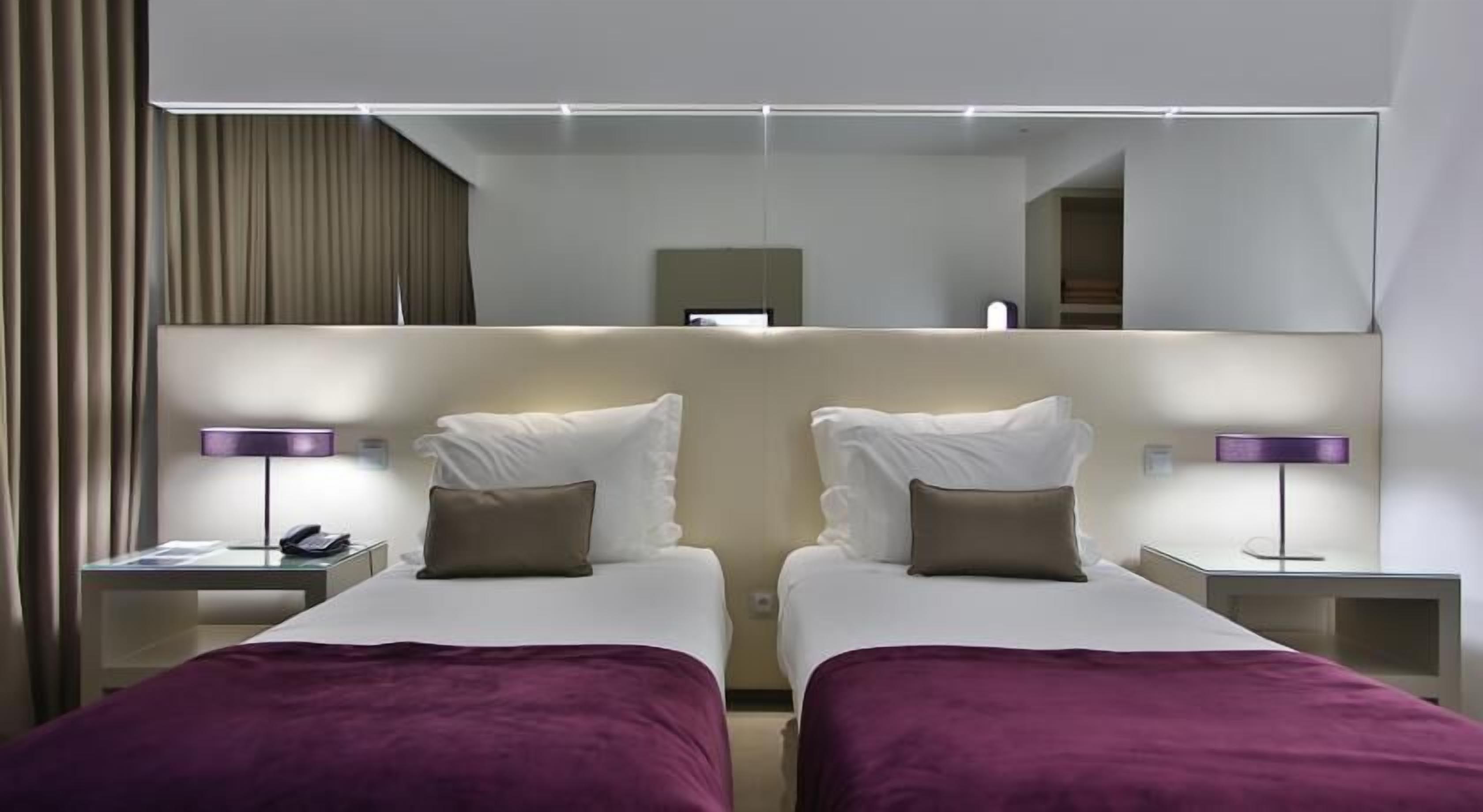 double or twin room, 1 double or 2 single beds, river view | minibar, in-room safe, desk, blackout curtains