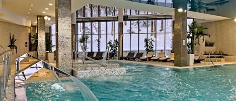 Indoor pool, open 7 AM to 11 PM, pool loungers