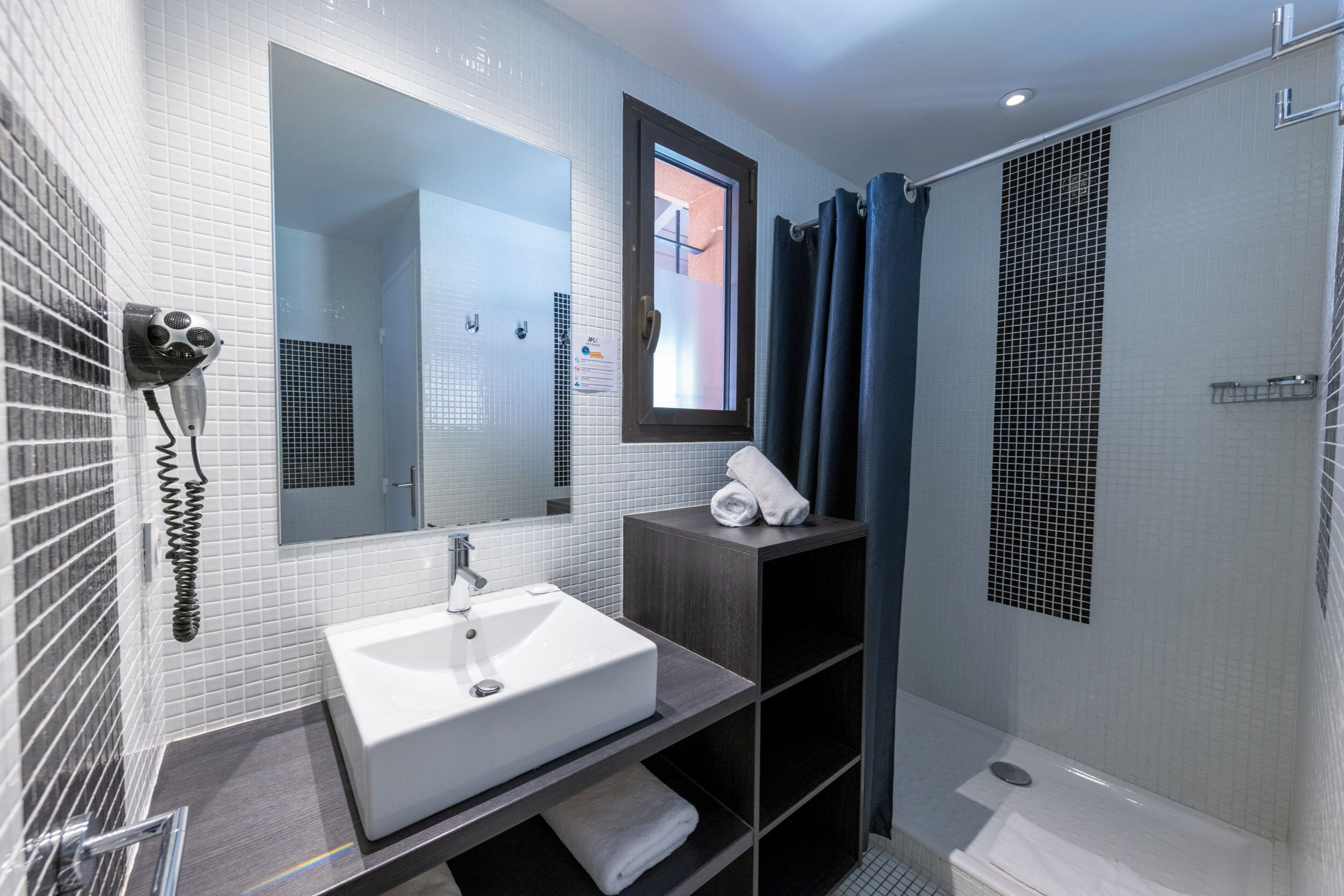 shower, free toiletries, hair dryer, towels