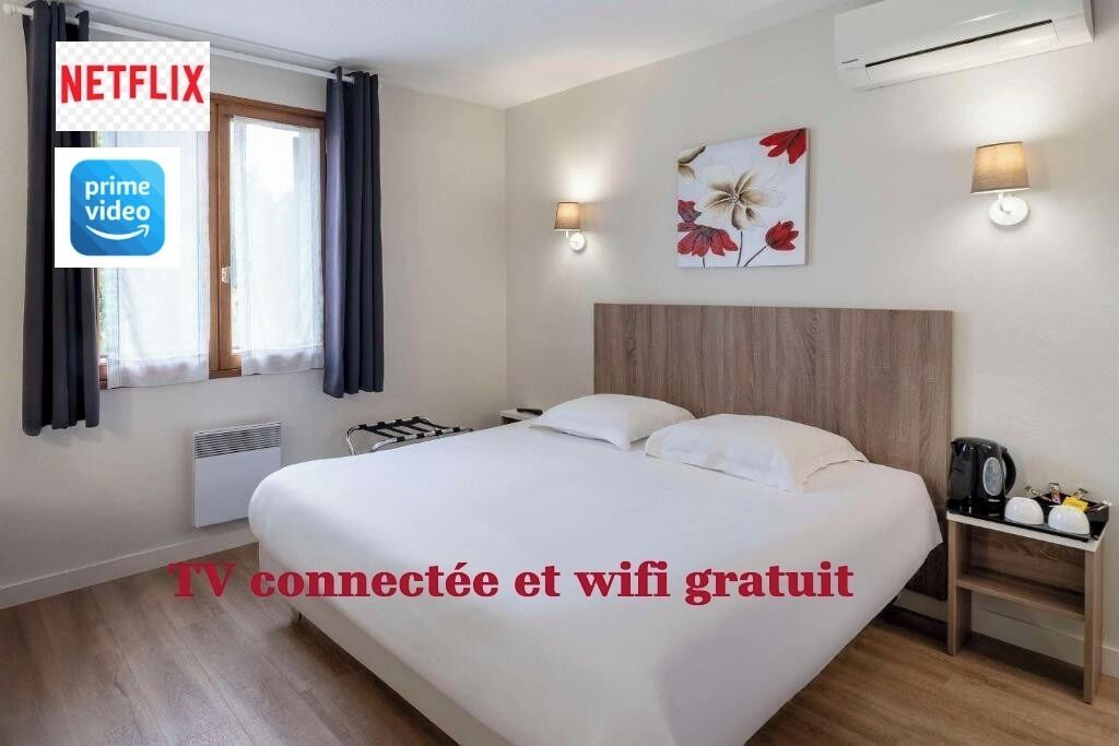 Habitación Confort, 1 cama Queen size, para no fumadores | Espacio para trabajar con laptop y cortinas blackout 