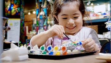 A child playing with colorful building blocks.