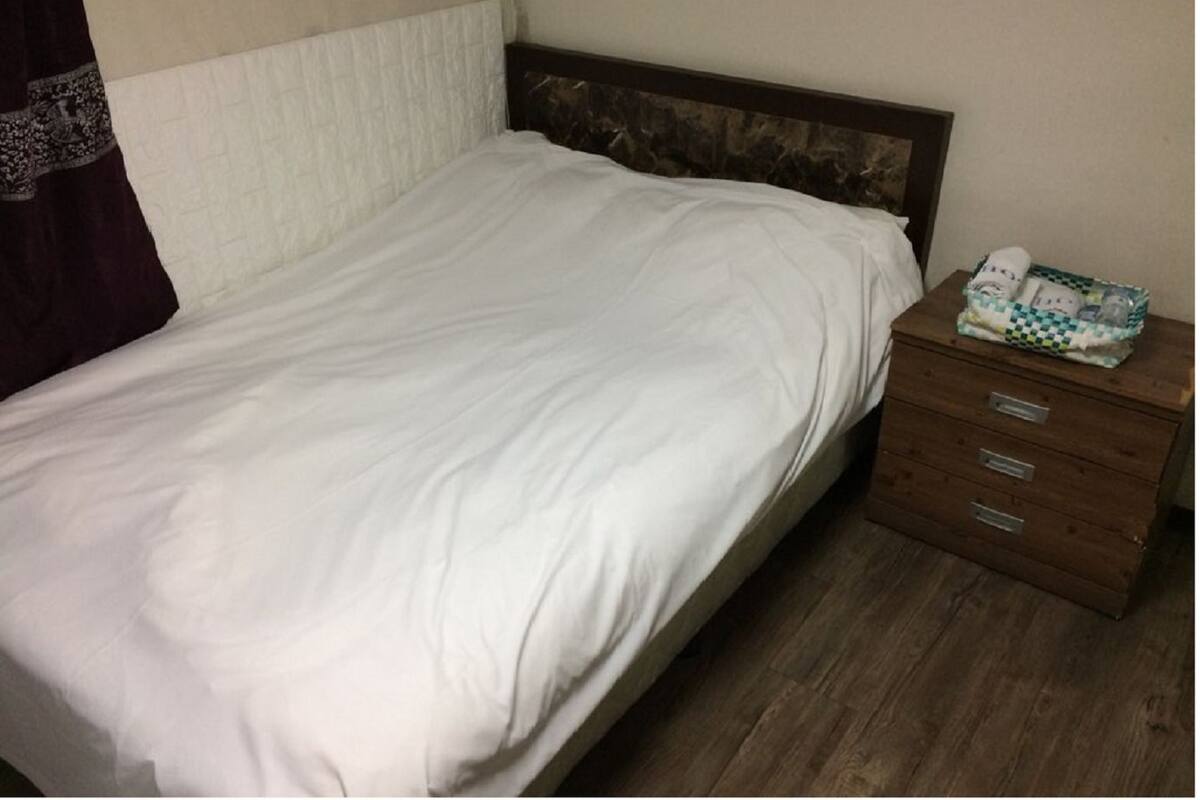 Economy Standard Double Room (Basement) | Down comforters, blackout drapes, WiFi (free)