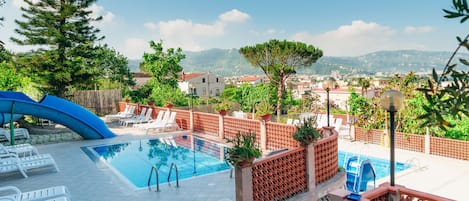 Seasonal outdoor pool, pool umbrellas, sun loungers