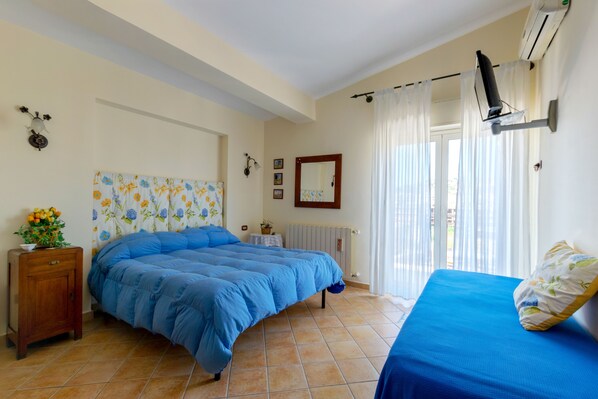 Standard Triple Room, City View | Down comforters, individually decorated, individually furnished, desk