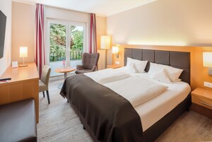 Basic Double Room | Minibar, in-room safe, desk, blackout drapes