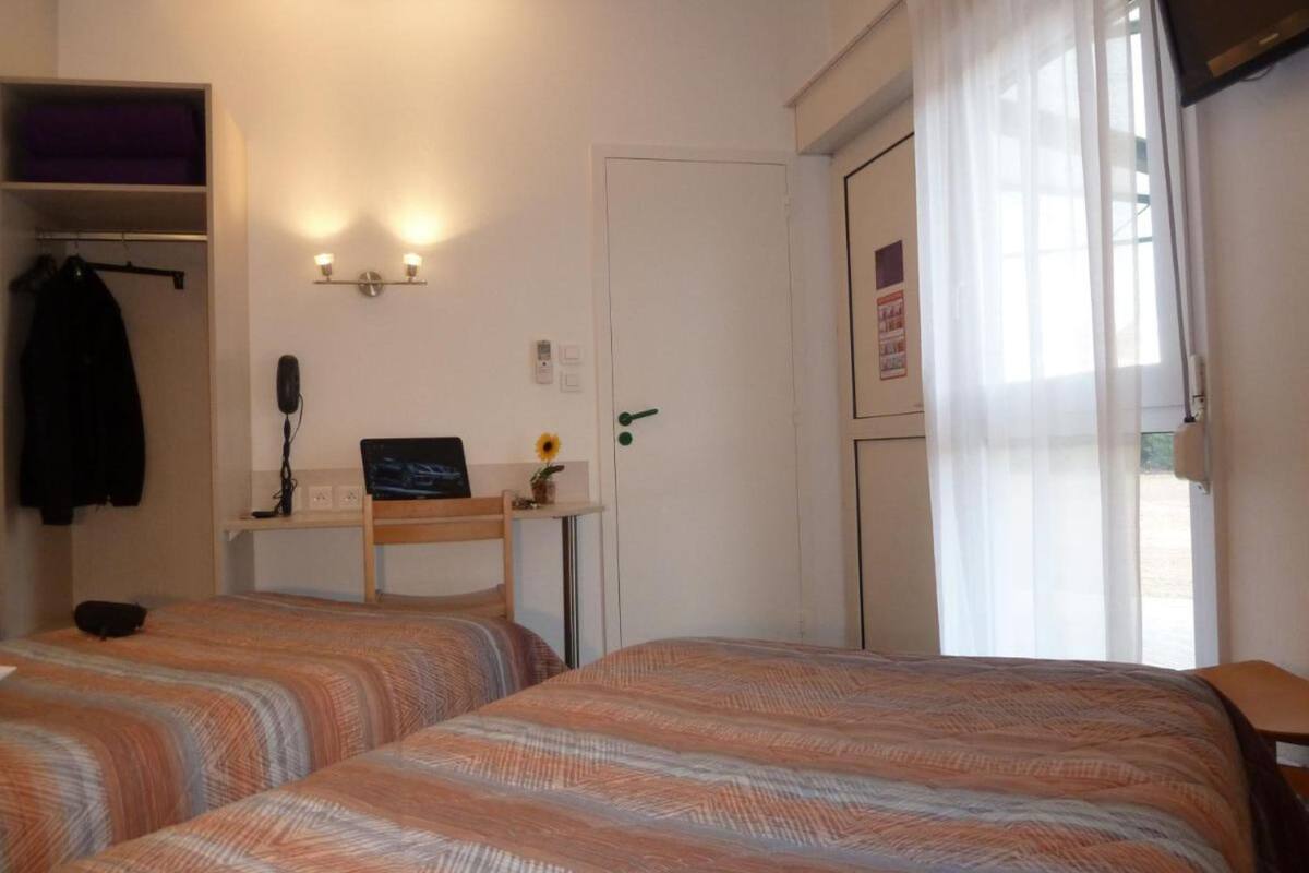 family room | desk, soundproofing, iron/ironing board, cots/infant beds