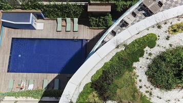 Seasonal outdoor pool, open 7:00 AM to 6:00 PM, pool umbrellas