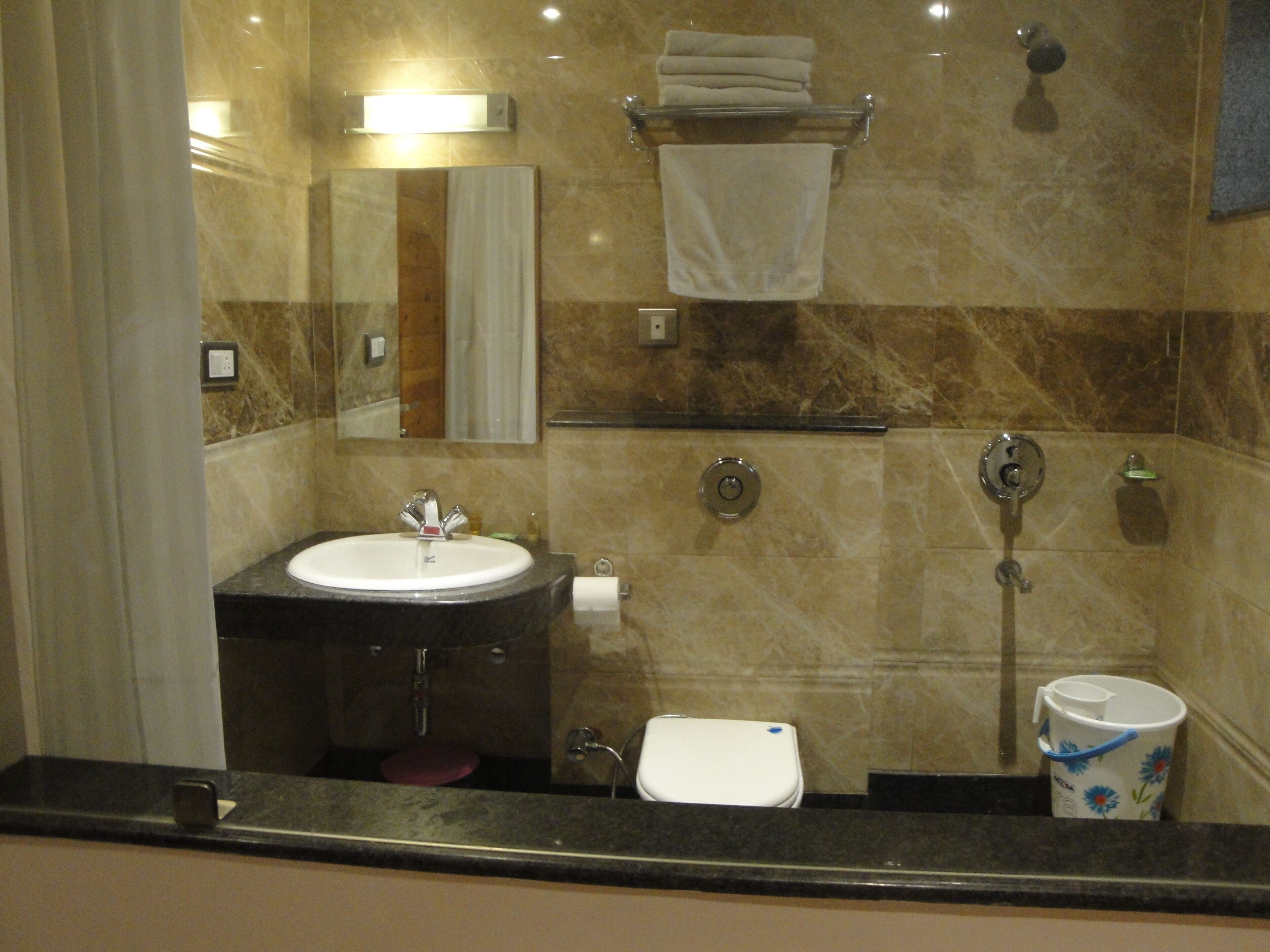super deluxe room | bathroom | shower, free toiletries, towels