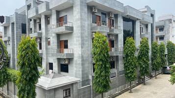 Stylish residential building with modern architecture and balconies.