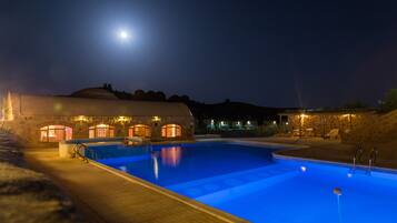 Outdoor pool, open 7:00 AM to 7:00 PM, pool umbrellas, pool loungers