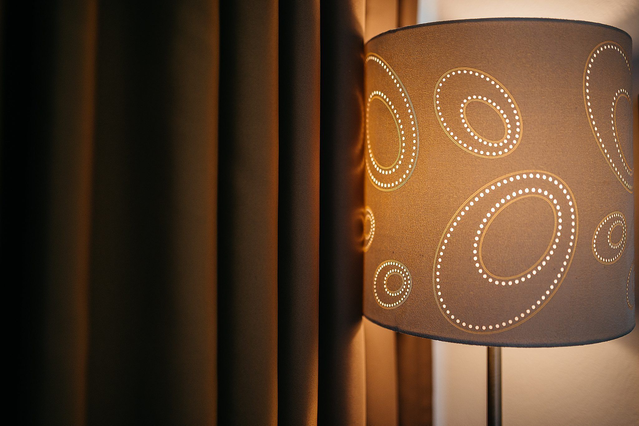 A lamp with a patterned shade.