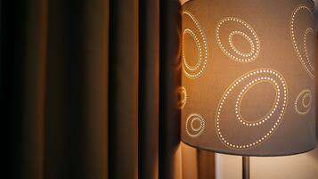 A lamp with a patterned shade.