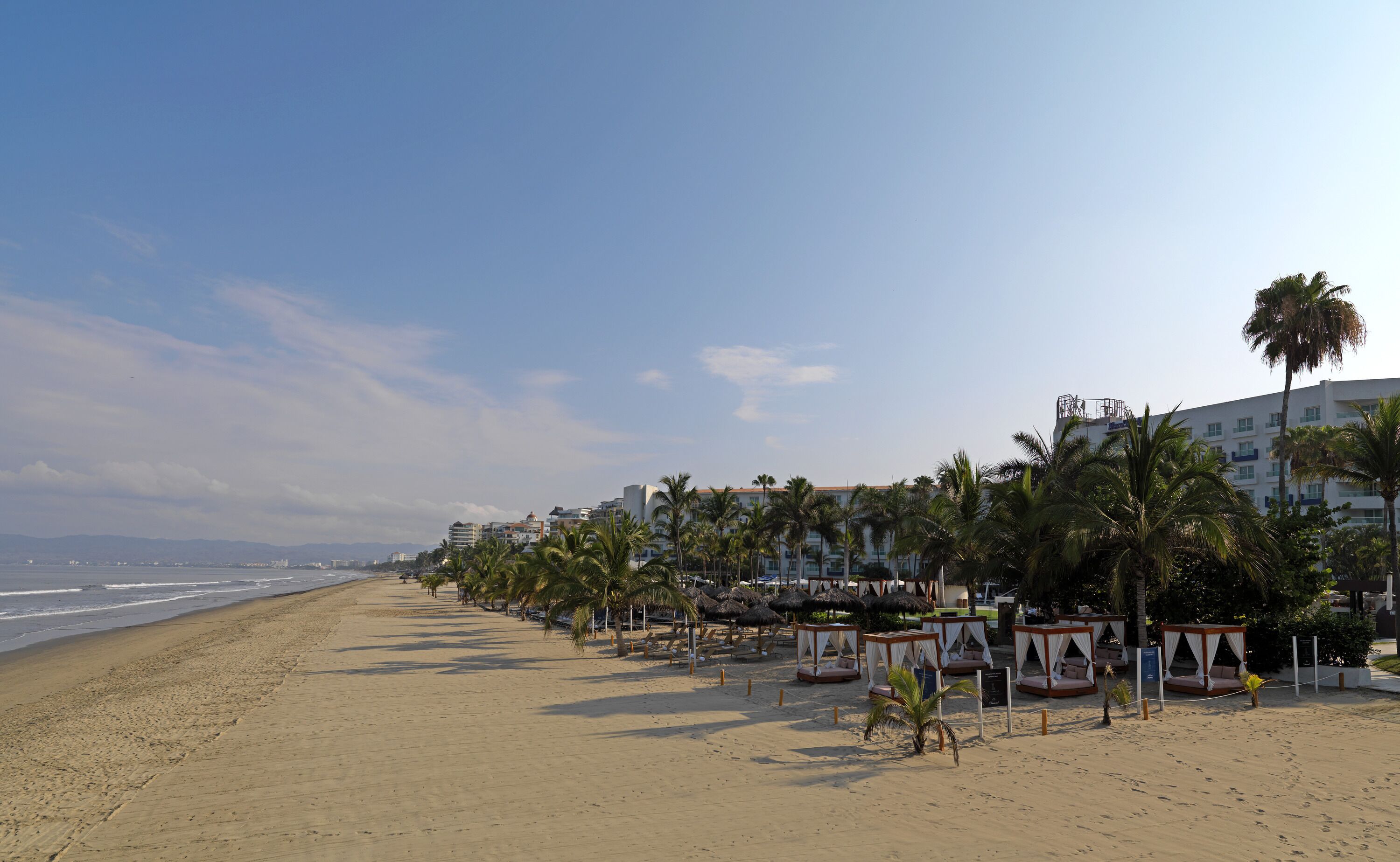 On the beach, beach cabanas, beach umbrellas, beach towels