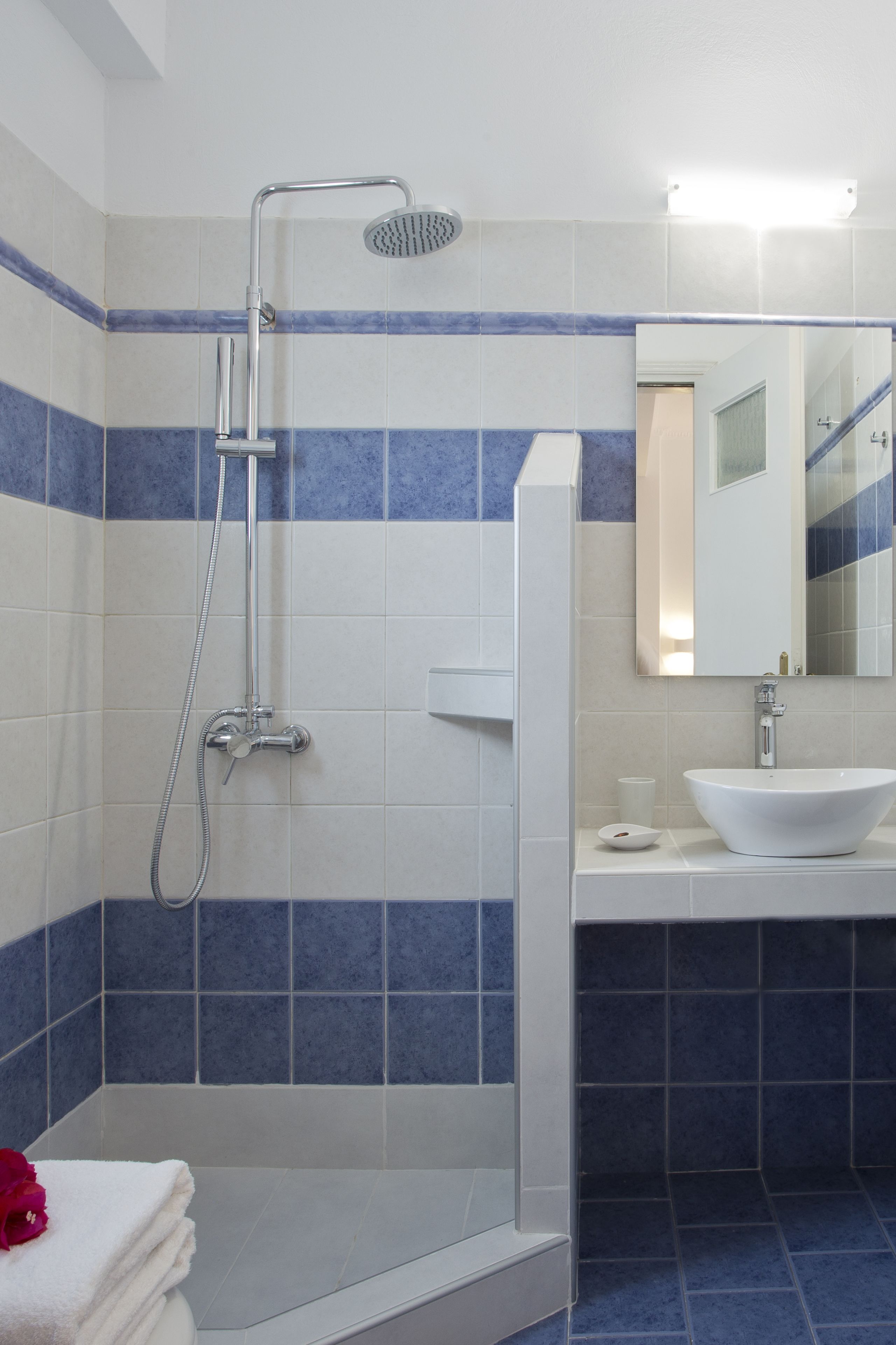 studio | bathroom | shower, rainfall showerhead, hair dryer, towels