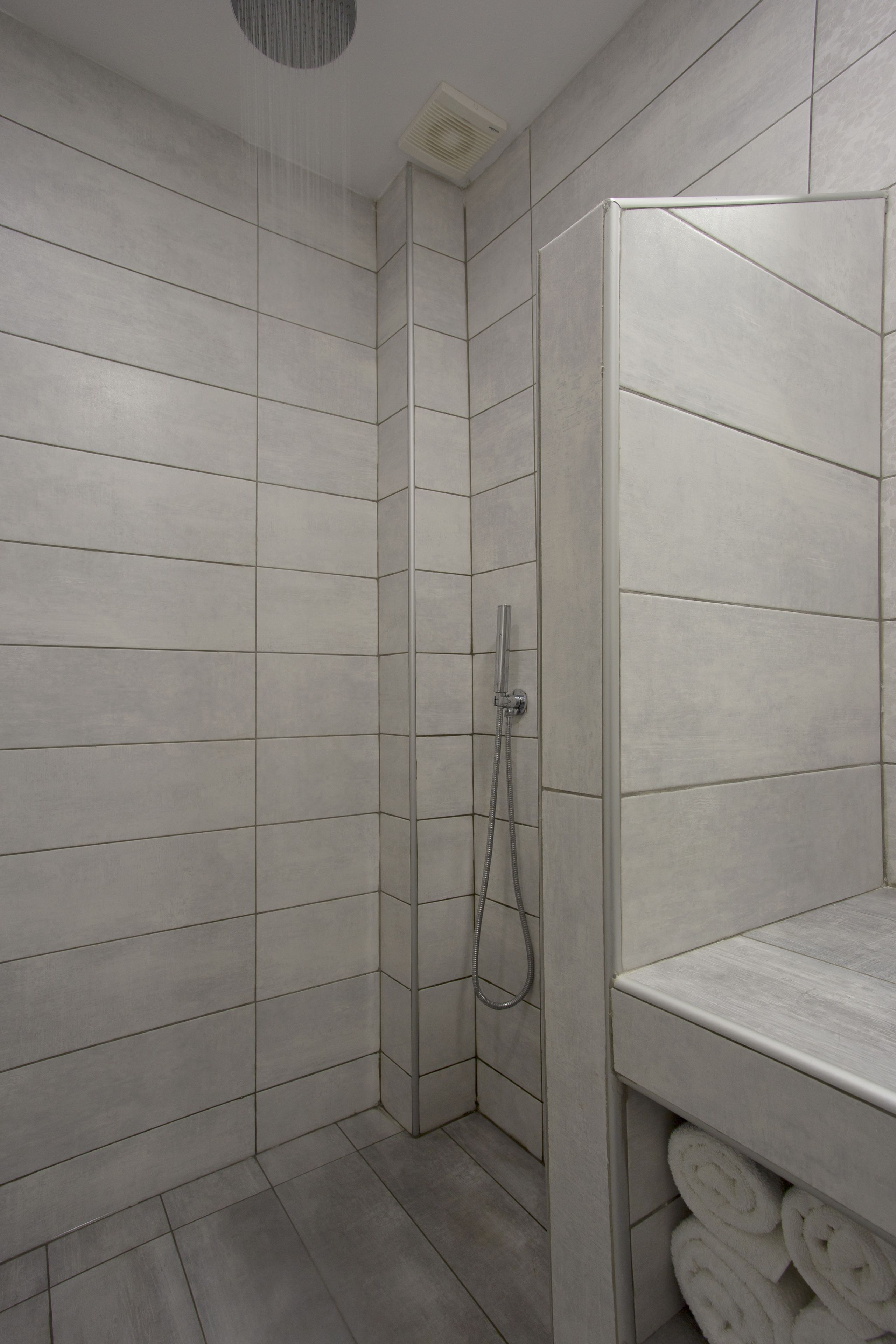 shower, rainfall showerhead, hair dryer, towels