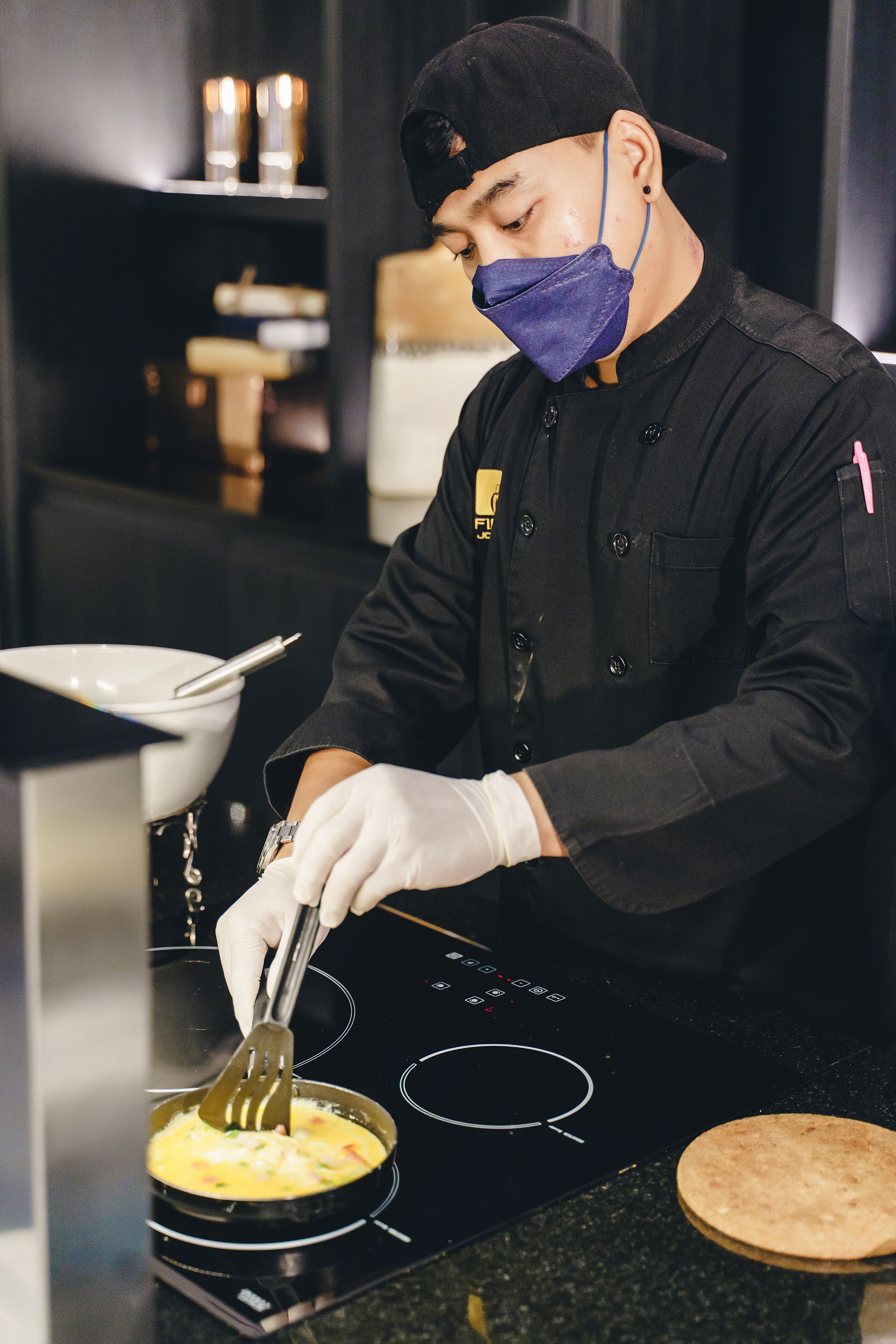 A chef preparing food in a kitchen.