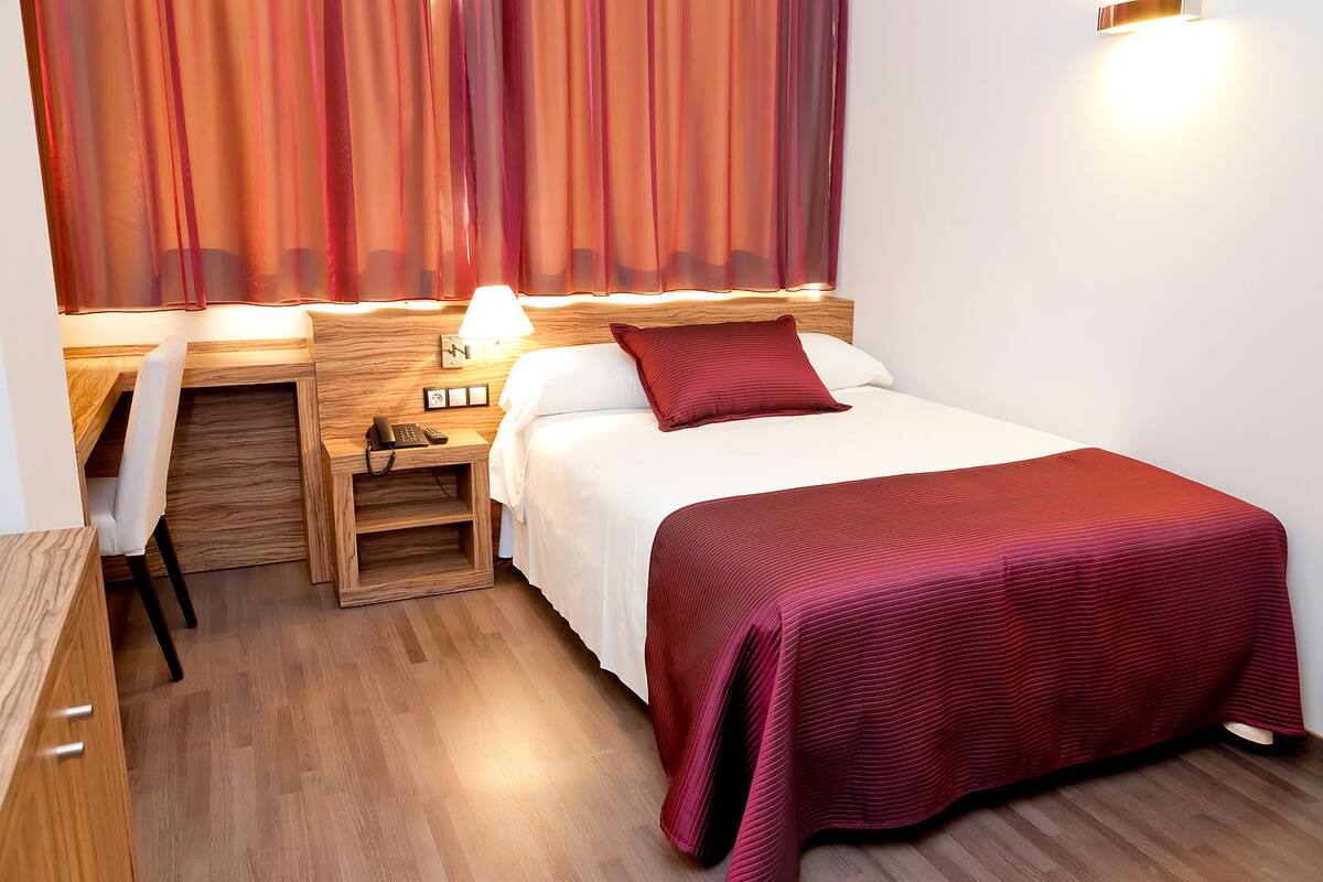 Memory-foam beds, minibar, in-room safe, desk