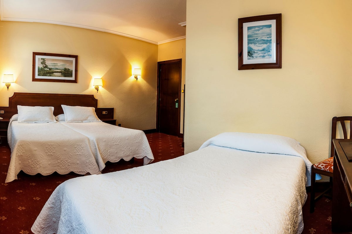 Standard Triple Room, City View | Desk, blackout drapes, free cribs/infant beds, free WiFi