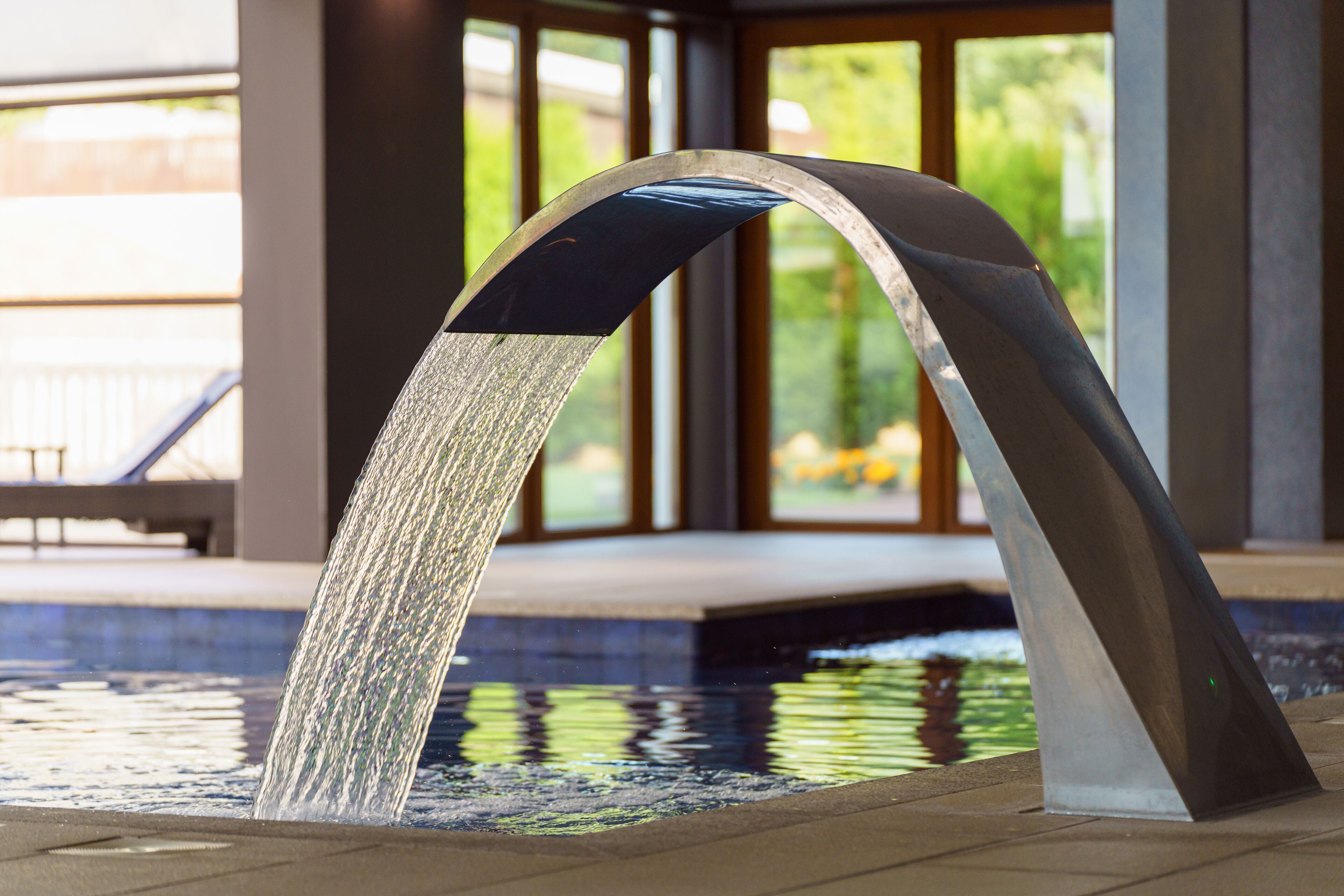 Indoor pool, open 7:00 AM to 10:00 PM, pool umbrellas, pool loungers